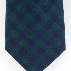 Cravate en soie tissée verte motif carré bleu marine